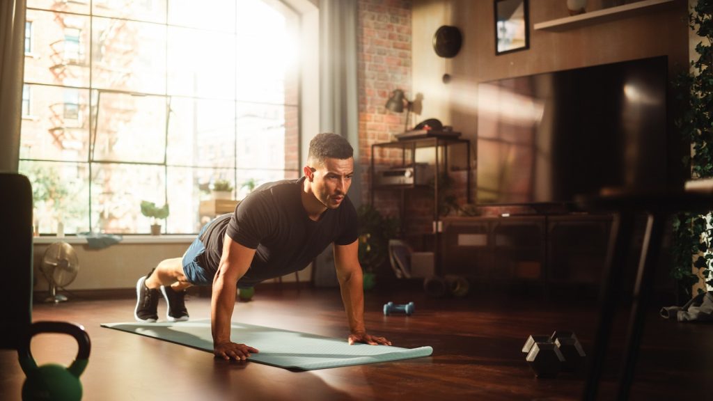 Strong Athletic Black Man Does Workout at Home