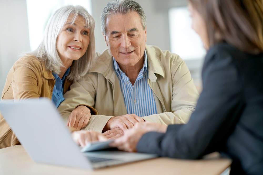 Senior couple meeting financial adviser
